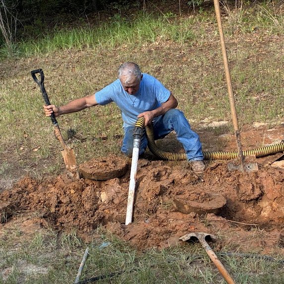Boyce Septic technician working at an East Texas septic system