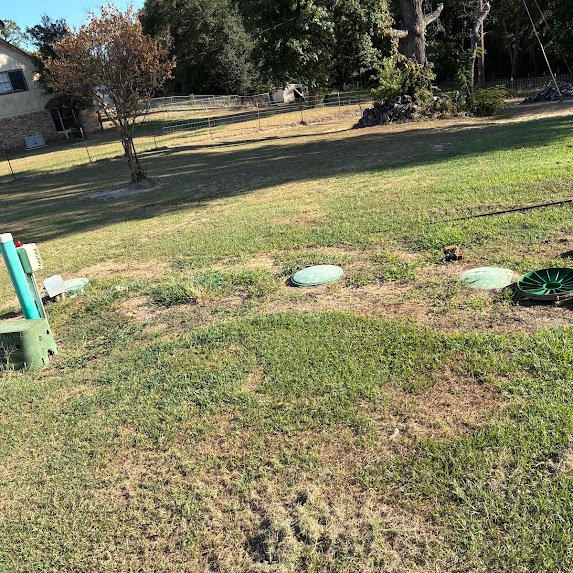 Septic system access lids at an East Texas property