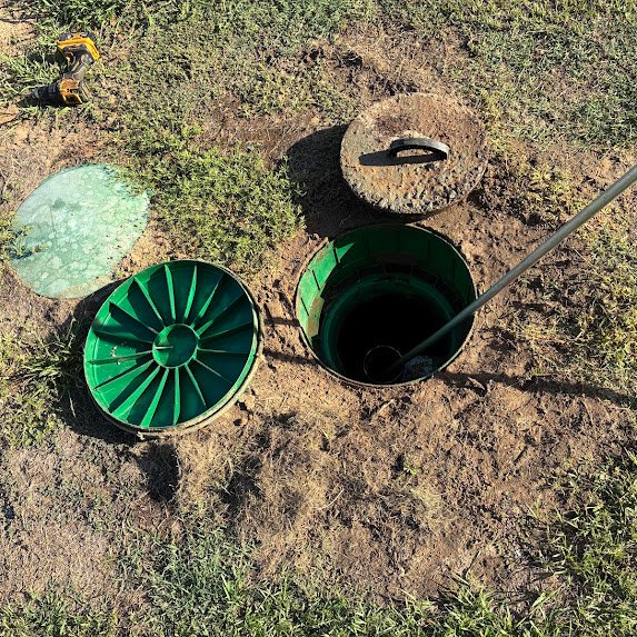 Open septic tank access prepared for service by Boyce Septic